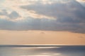 Summer time. Golden hour or Glowing sea. Ocean view and Sunset. Calming water with floating yacht. Nature scenery Royalty Free Stock Photo