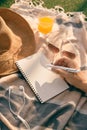 Summer time -  hands with pen writing on notebook in the park Royalty Free Stock Photo