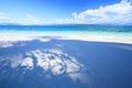 Summer time, leaf shade on white sand beach under the sunshine a