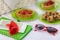 Summer time: picnic on the grass - cake and berries, ebook and n Royalty Free Stock Photo