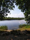 Summer time. rest by the river, on yellow sand, in the shade of trees