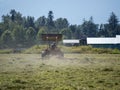 Summer time scene of a farmer working his field on an old tractor Royalty Free Stock Photo