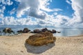 Summer time sea beach sandy coast and stones Royalty Free Stock Photo