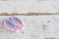 Summer time vacation concept. Beach Accessories shoe on white vintage wooden background Royalty Free Stock Photo