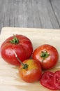 Summer tomatoes on wood background with copy space Royalty Free Stock Photo