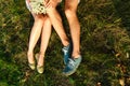 Summer top view of romantic man and woman lying on the field. The concept of a beautiful family. Young couple lying on a green mea