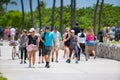 Summer tourists walking on Ocean Drive Miami Beach. Shot with a telephoto lens