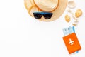 Summer travaling to the sea with straw hat, sun glasses, tickets and passport on white background top view mock up Royalty Free Stock Photo