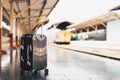 Summer travel concept. Luggage with .straw hat on train station near railway. Royalty Free Stock Photo