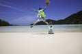 Summer travel concept which happy man jumping on beach background Royalty Free Stock Photo