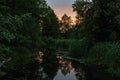 Silence evening on forest river.