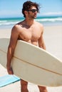 Summer, travel and a man surfer on the beach for surf, freedom or adventure on vacation. Nature, sand and a young person Royalty Free Stock Photo