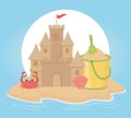 Summer travel and vacation sand castle bucket shovel crab and shell