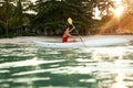 Summer Travel. Woman Kayaking In Sea Water Near Green Island Royalty Free Stock Photo