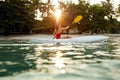 Summer Travel. Woman Kayaking In Sea Water Near Green Island Royalty Free Stock Photo