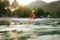 Summer Travel. Woman Kayaking In Sea Water Near Green Island Royalty Free Stock Photo