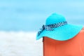 Summer traveling with old suitcase and Fashion woman, fish star, sun glasses, hat. Travel in the holiday, blue sky and beach backg