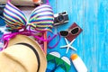 Summer traveling with old suitcase and Fashion woman swimsuit Bikini, fish star, sun glasses, hat. Travel in the holiday, sunset b Royalty Free Stock Photo