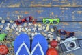 Summer traveling time. Sea holiday background with various shells, vintage camera, sun glasses and Place for your text. Lay design Royalty Free Stock Photo