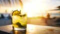 summer tropical beach longdrink cocktail mojito on the background of the sunset over beach, sea or ocean. Vacation summer concept