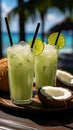 Summer tropical cocktail in fresh green coconut with two colorful umbrellas on palm tree leaves background Royalty Free Stock Photo
