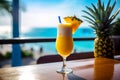 Glass of cold fresh summer cocktail on wooden table with ocean view on background Royalty Free Stock Photo