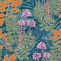 Summer tropical jungle seamless floral pattern on dark blue background. Various colorful leaves and plants with flowers Royalty Free Stock Photo