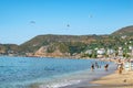 Summer tropical landscape at Kleopatra beach in Alanya. People swim in the blue water of the