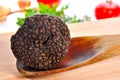 Summer truffle on a wooden spoon