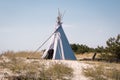 Summer vacation camping tent, indian wigwam hut, in dry wild nature prairie steppe desert Royalty Free Stock Photo