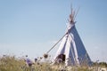 Summer vacation camping tent, indian wigwam hut, in dry wild prairie steppe desert Royalty Free Stock Photo