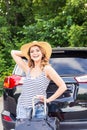 Summer vacation car road trip freedom concept. Happy woman cheering joyful during holiday travel with car. Royalty Free Stock Photo