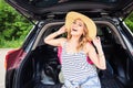 Summer vacation car road trip freedom concept. Happy woman cheering joyful during holiday travel with car. Royalty Free Stock Photo