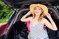 Summer vacation car road trip freedom concept. Happy woman cheering joyful during holiday travel with car. Royalty Free Stock Photo