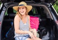 Summer vacation car road trip freedom concept. Happy woman cheering joyful during holiday travel with car. Royalty Free Stock Photo