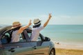 Family car trip at the sea, Woman and child cheerful raising their hands up and feeling happiness. Royalty Free Stock Photo