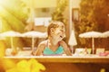 Summer vacation and childhood concept. Portrait of happy child girl having fun in swimming pool Royalty Free Stock Photo