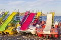 Summer vacation concept background.Pedal boats or paddle boats on beach sand .Mediterranean Sea, Spain Royalty Free Stock Photo