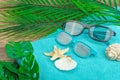 Summer vacation concept. Bath towel, sunglasses, marine decor