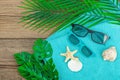 Summer vacation concept. Bath towel, sunglasses, marine decor