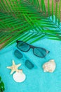 Summer vacation concept. Bath towel, sunglasses, marine decor