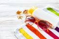 Summer vacation concept. colorful towel, sunglasses, yellow suns Royalty Free Stock Photo