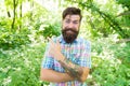 Summer vacation concept. Explore wild nature activity. Man bearded hipster green trees background. Emotional nature Royalty Free Stock Photo