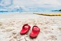 Summer vacation concept - slippers on tropical beach. Leisure in summer