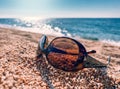 Summer vacation concept, sunglasses on sea sand, seashore, seaside, ocean beach. Mediterranean sea Royalty Free Stock Photo