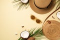 Summer vacation concept. Top view photo of sunhat round rattan bag sunglasses cracked coconuts and green palm leaves on isolated Royalty Free Stock Photo