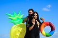 Summer vacation couple. Summertime concept. Man and woman with inflatable mattress. Sexy lovers in swimsuit on sea. Royalty Free Stock Photo