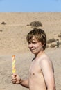 Summer vacation: cute teen with icecream at the beach Royalty Free Stock Photo