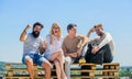 Summer vacation. Discussing ideas. Cheerful friends relaxing. Carefree friends. True friendship. Being sincere with Royalty Free Stock Photo