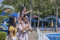 Summer vacation. Families with parents and children are hanging out in the water park. Happy family having fun at water park Royalty Free Stock Photo
